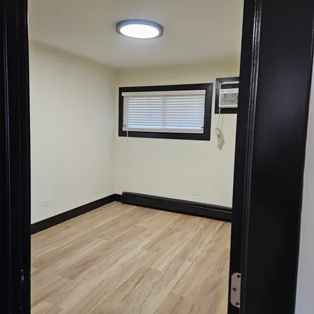 a view of an empty room with a window