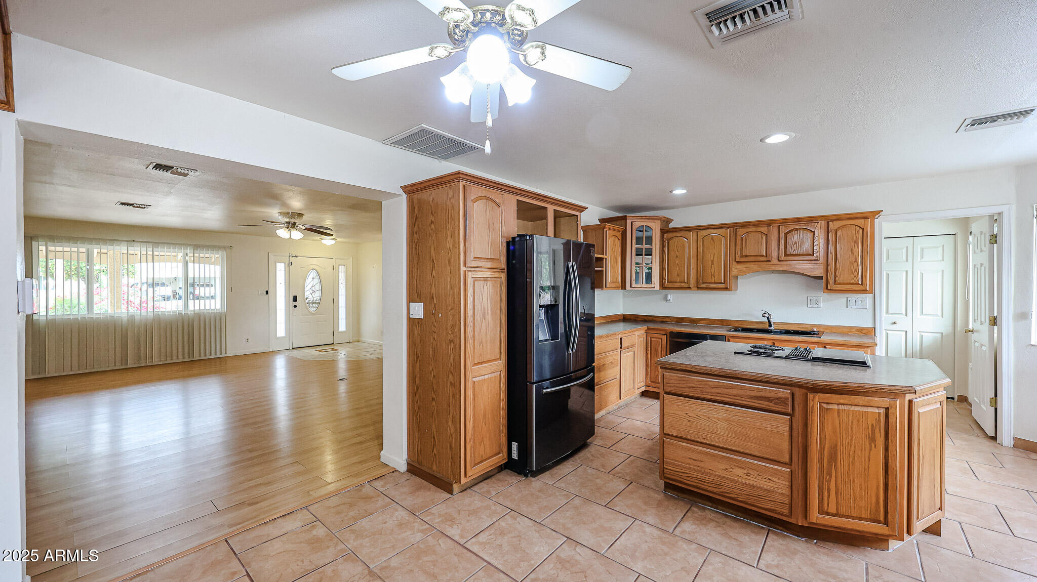 11851 North Thunderbird Road Sun City, AZ 85351 - Photo 11 of 46 a kitchen with stainless steel appliances granite countertop a refrigerator and a stove