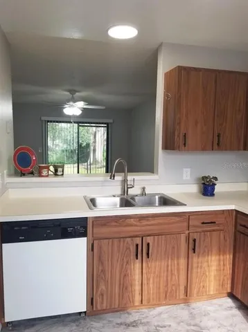 an empty room with wooden floor and mirror