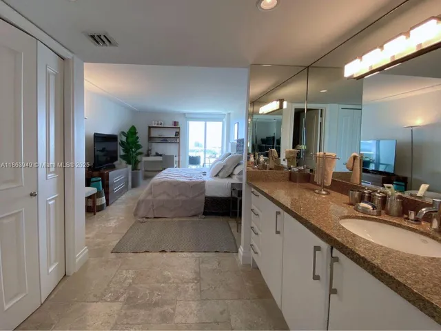 a large bathroom with a sink double vanity and a mirror