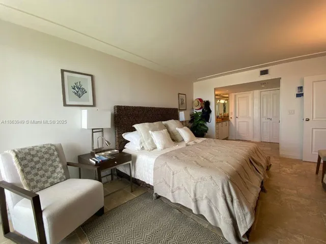 a bed room with a bed and a couch