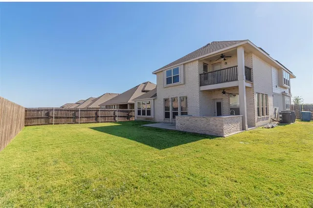 a big house with swimming pool in front of it