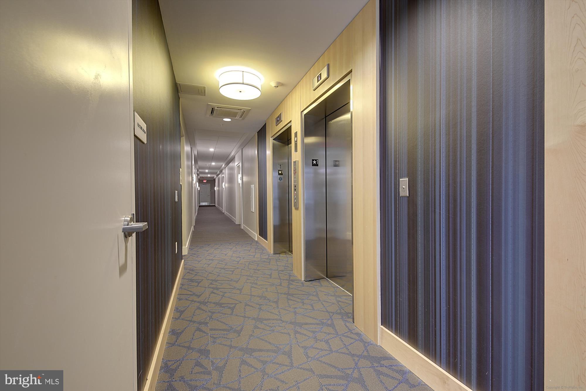 1320 Fenwick Lane, Unit 312 Silver Spring, MD 20910 - Photo 26 of 44 a view of a hallway