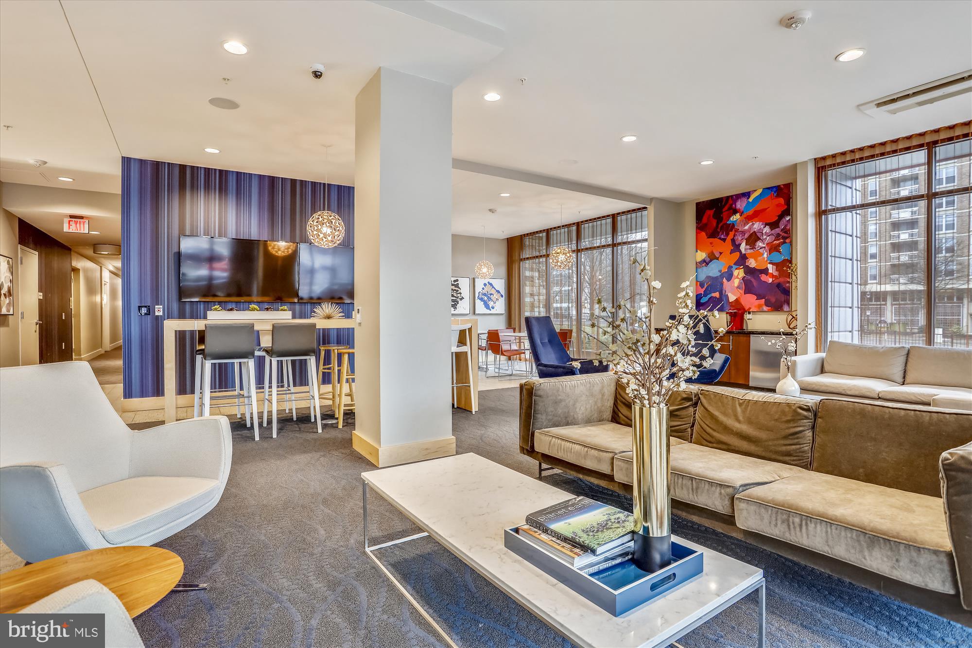 1320 Fenwick Lane, Unit 312 Silver Spring, MD 20910 - Photo 4 of 44 a living room with furniture kitchen view and a large window