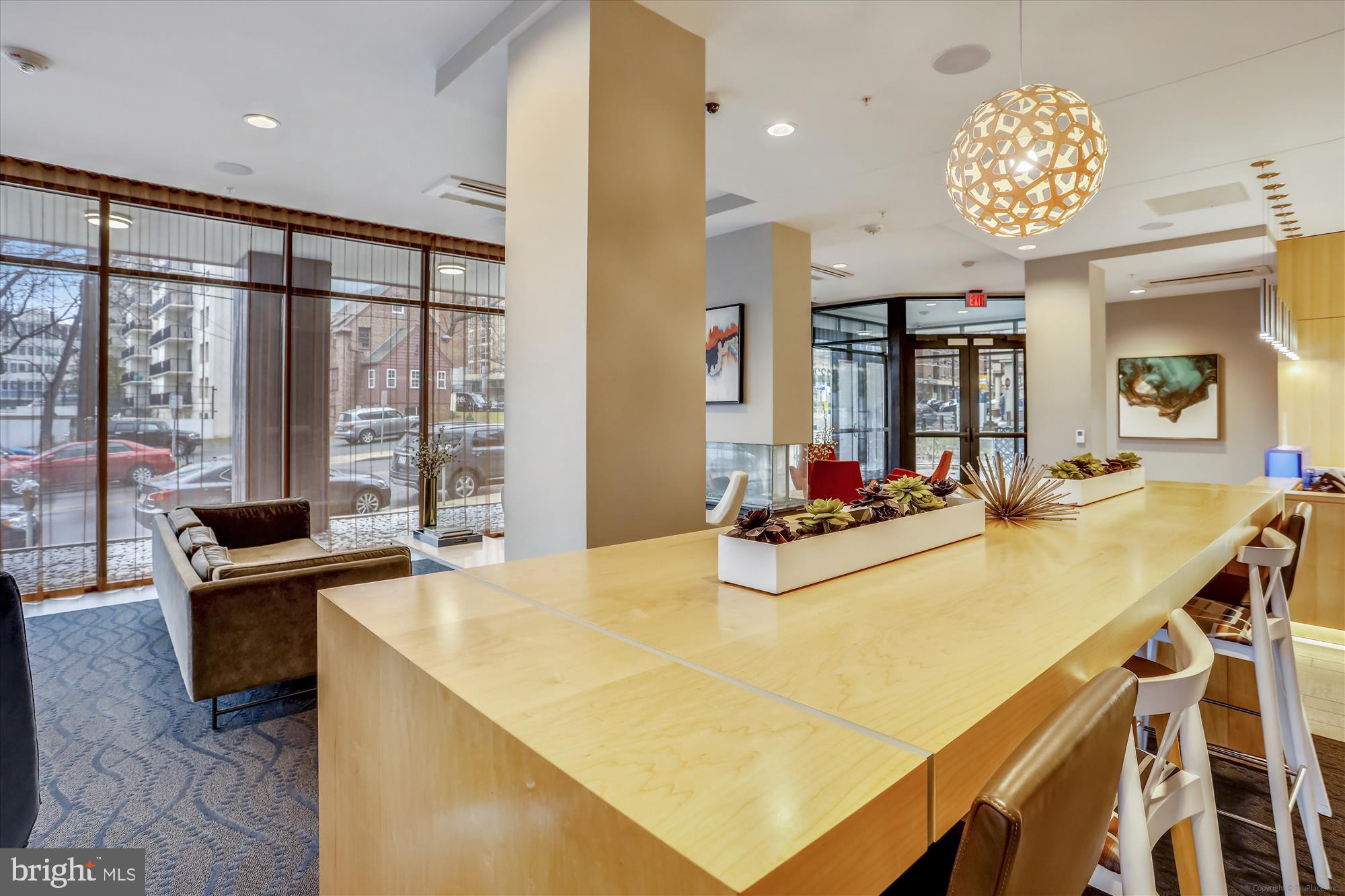 1320 Fenwick Lane, Unit 312 Silver Spring, MD 20910 - Photo 6 of 44 a view of a dining room with furniture and a large window