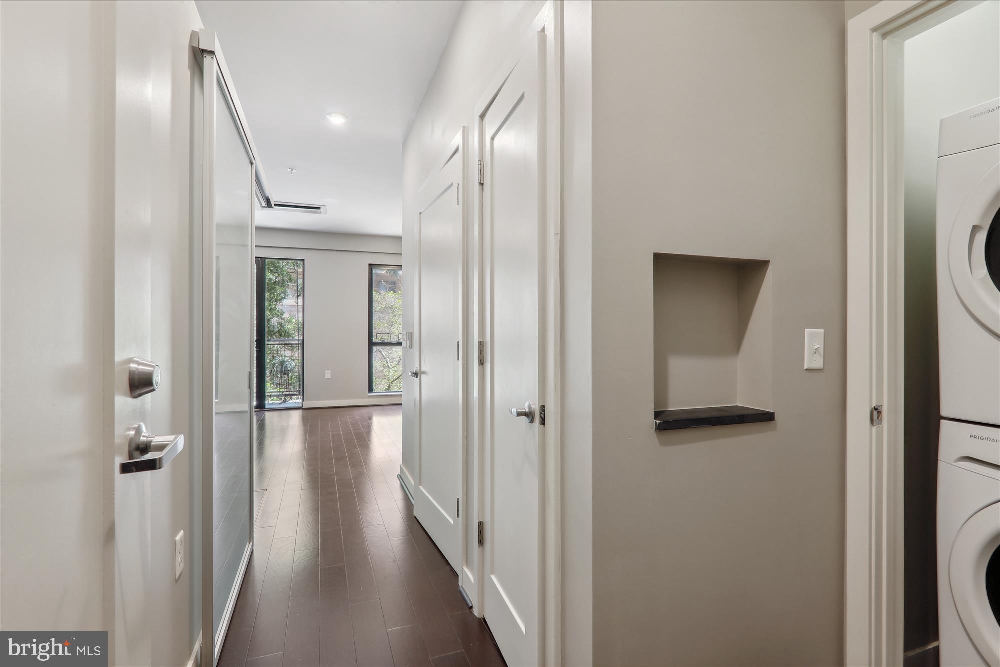 1320 Fenwick Lane, Unit 312 Silver Spring, MD 20910 - Photo 7 of 44 a view of a hallway with wooden floor