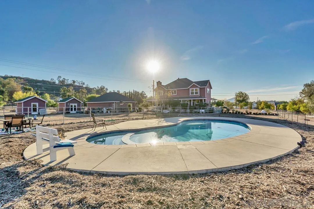 1880 Keyes Road Ramona, CA 92065 - Photo 35 of 49 a view of a swimming pool with a lawn chairs
