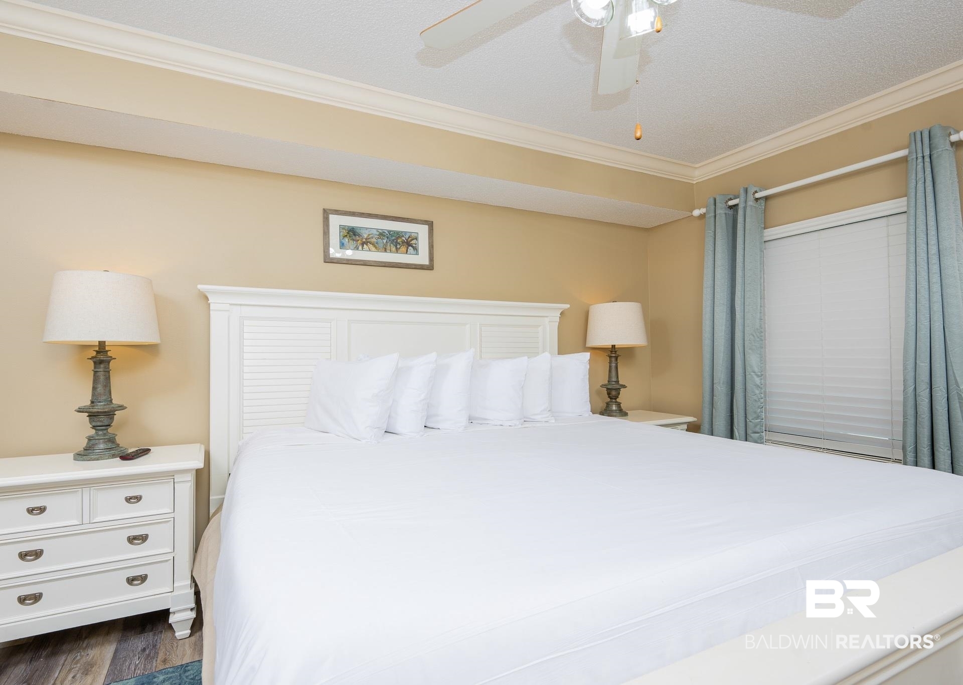 27580 Canal Road, Unit 1429 Orange Beach, AL 36561 - Photo 10 of 45 Bedroom with crown molding, a ceiling fan, a textured ceiling, and dark wood-style floors