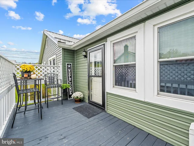 a view of a balcony with wooden floor