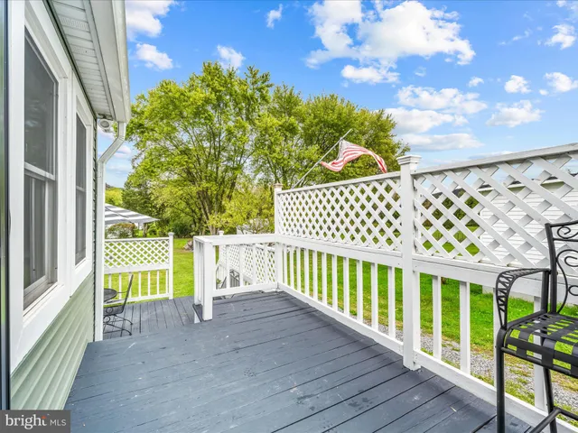 a view of a chairs and table in the patio