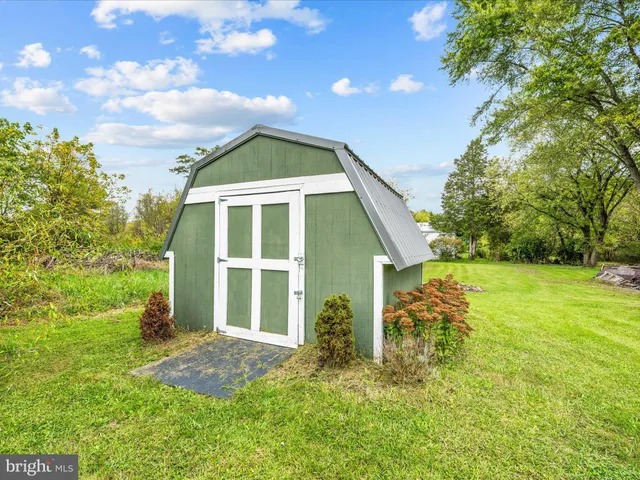 a view of a park with large trees