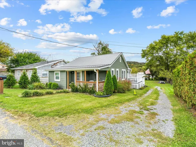 a view of a house with a big yard