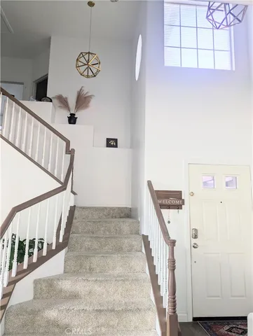 a view of a hallway with stairs