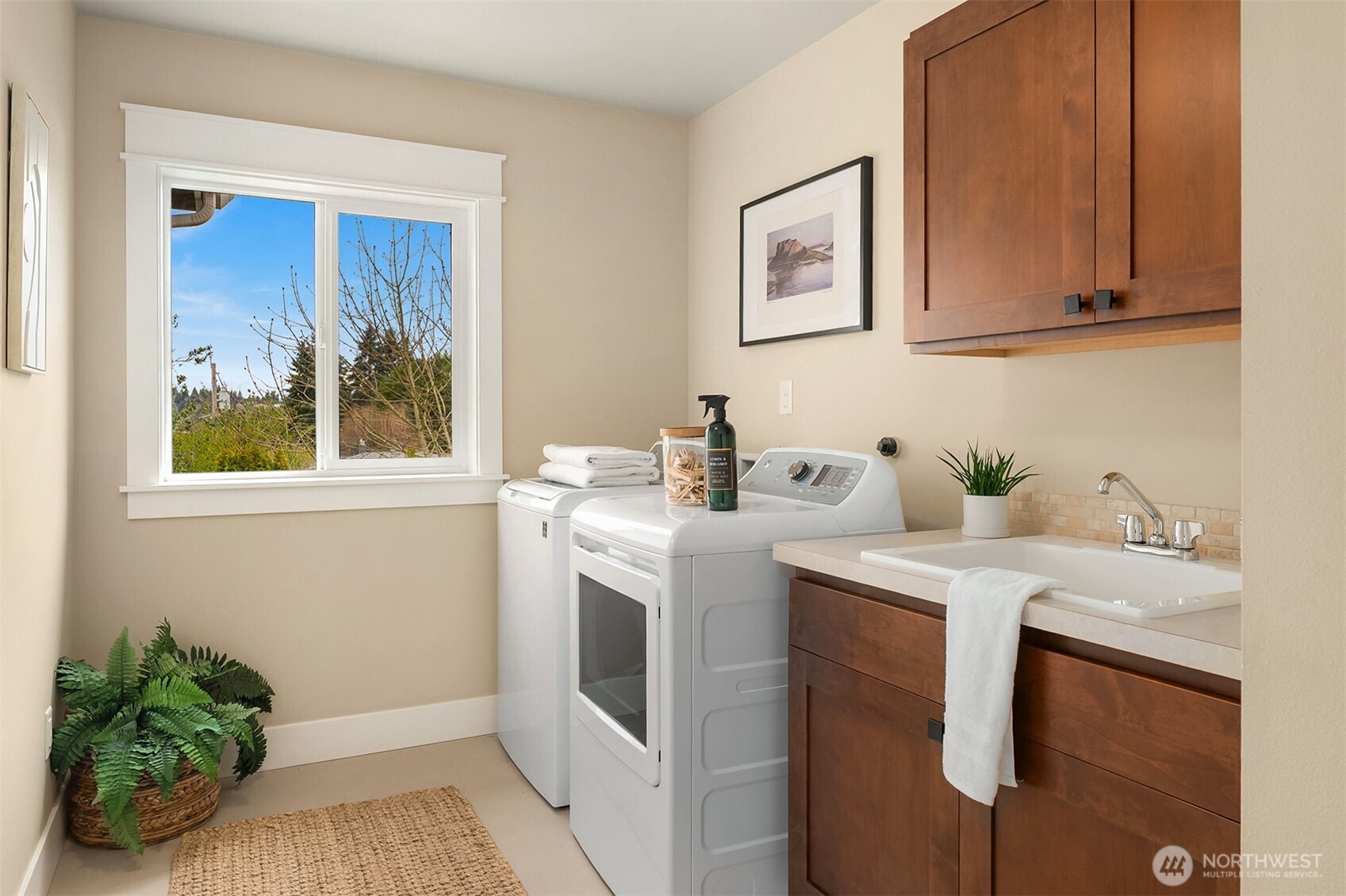 632 Southwest 185th Street Normandy Park, WA 98166 - Photo 24 of 39 a view of cabinets a sink and a window in a room