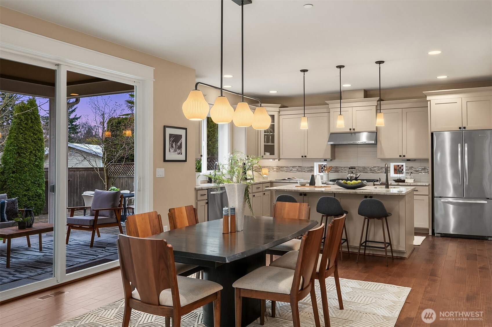 632 Southwest 185th Street Normandy Park, WA 98166 - Photo 7 of 39 a dining room with stainless steel appliances kitchen island granite countertop a dining table chairs and a oven