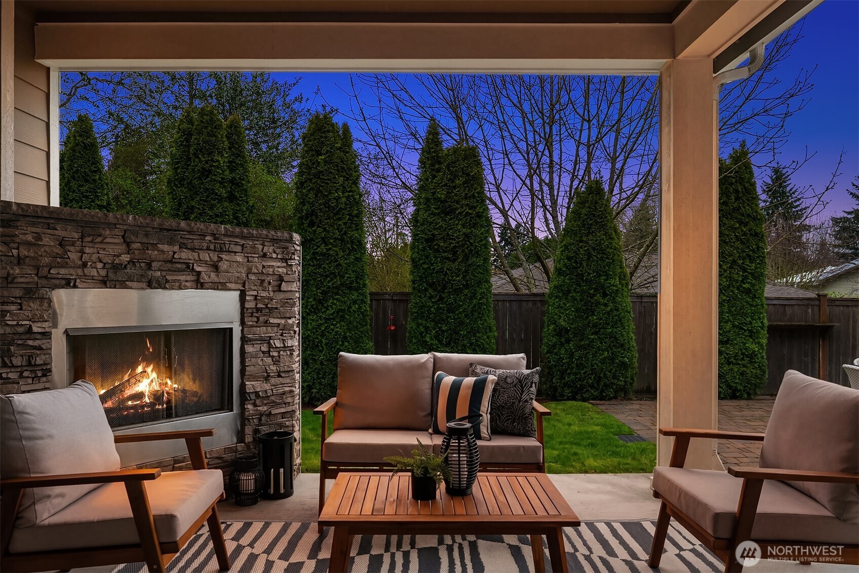 632 Southwest 185th Street Normandy Park, WA 98166 - Photo 8 of 39 a view of a patio with a dining table and chairs with a fire pit
