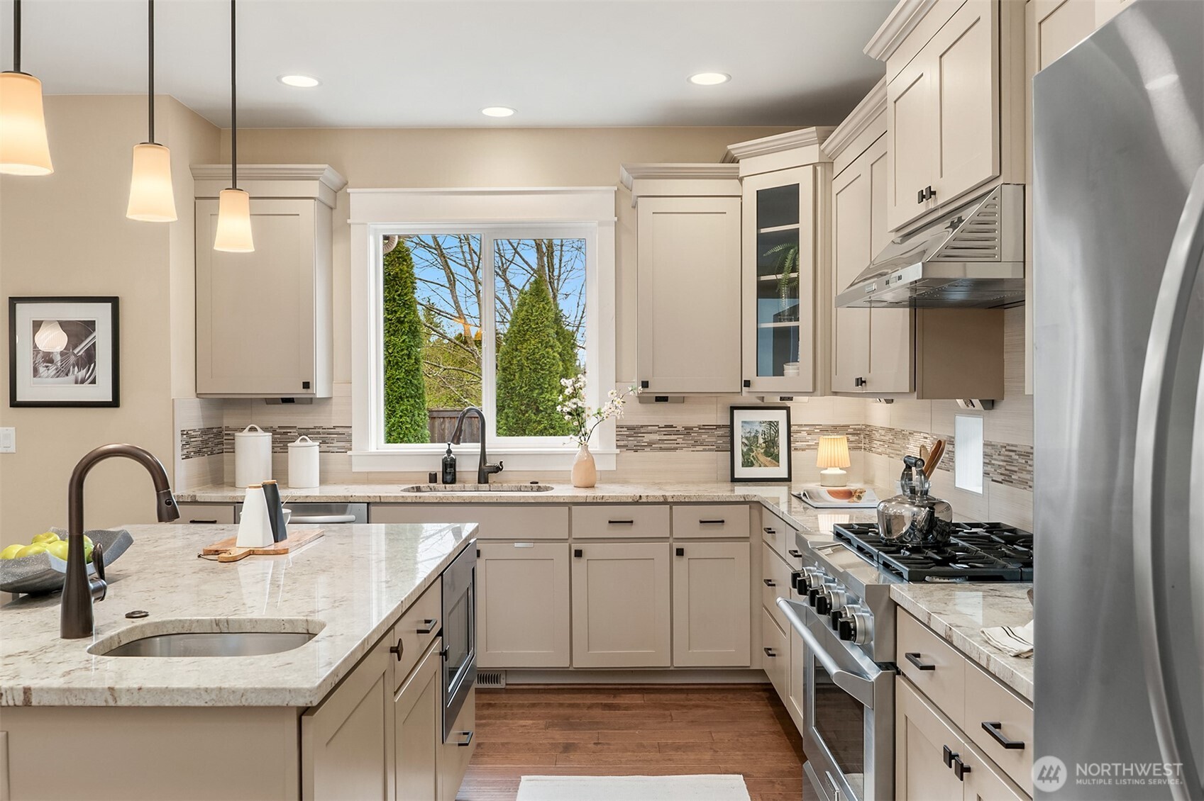 632 Southwest 185th Street Normandy Park, WA 98166 - Photo 10 of 39 a kitchen with a sink stove and cabinets