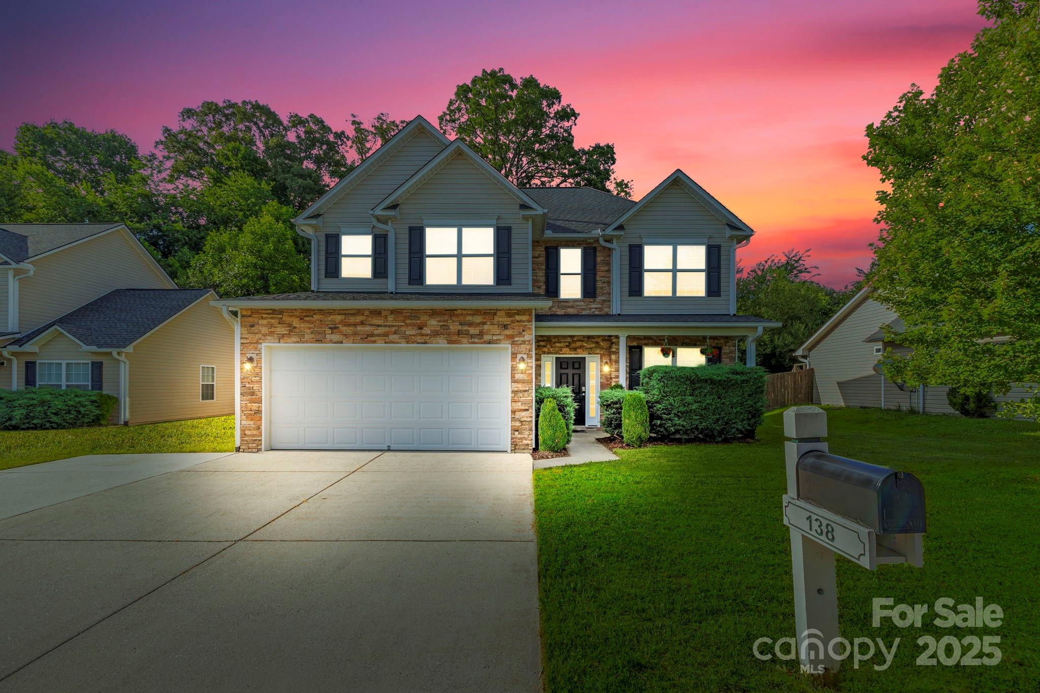 138 Black River Road Fletcher, NC 28732 - Photo 3 of 46 a front view of a house with a yard and garage