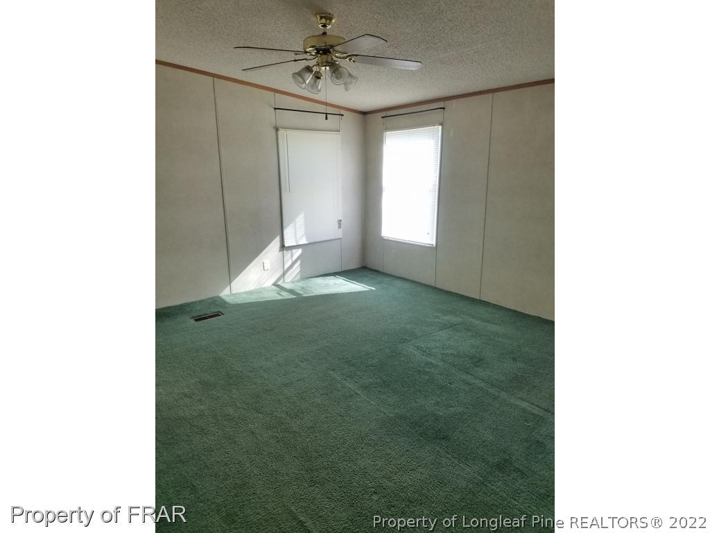 3399 Cabin Museum Road Turkey, NC 28393 - Photo 9 of 11 a view of empty room with ceiling fan