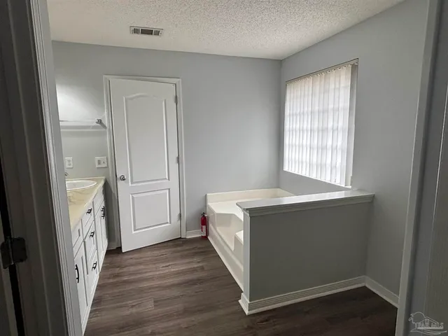 a room with a bed and a window