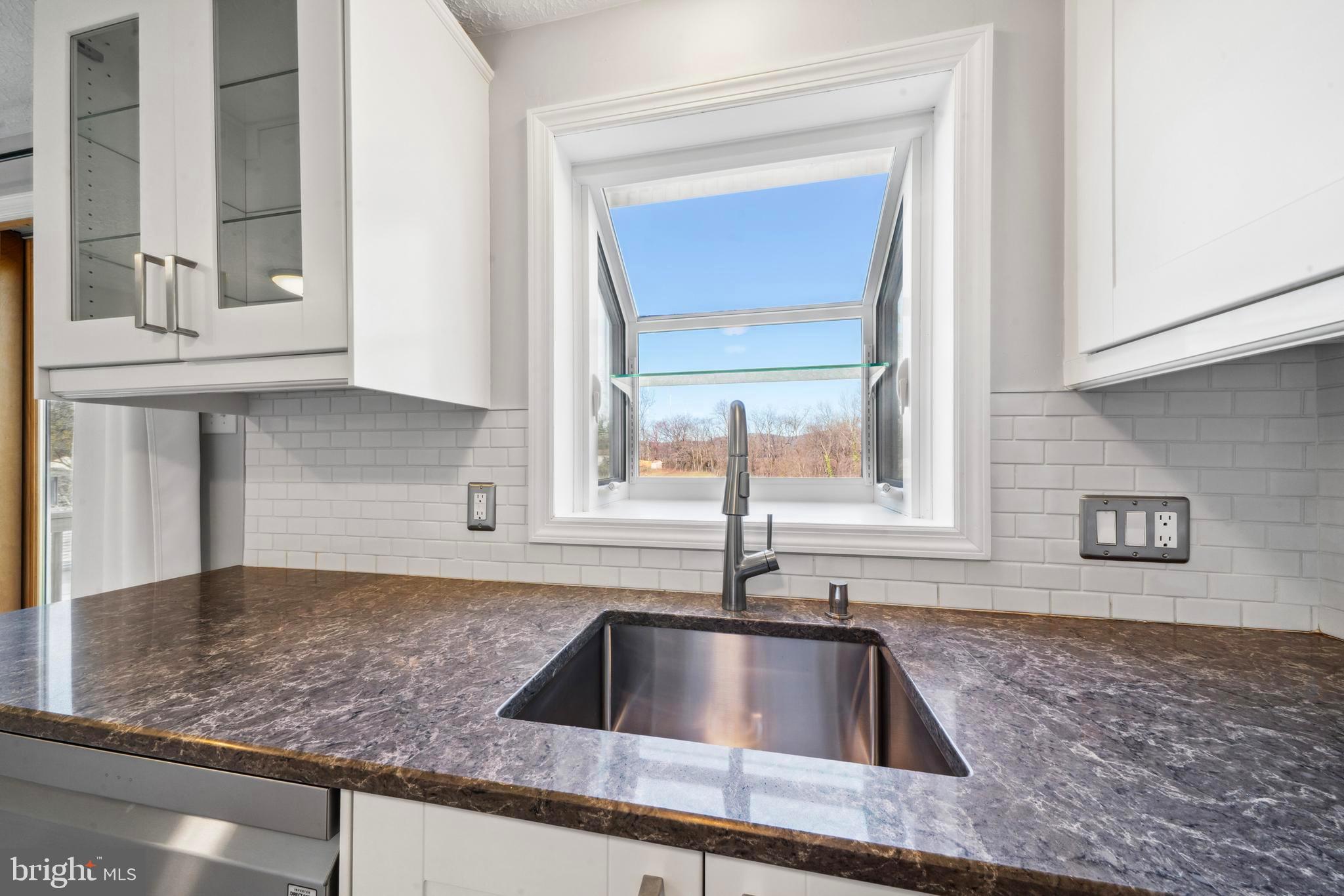 1335 Orchard Way Frederick, MD 21703 - Photo 11 of 42 a kitchen with granite countertop a sink and a window