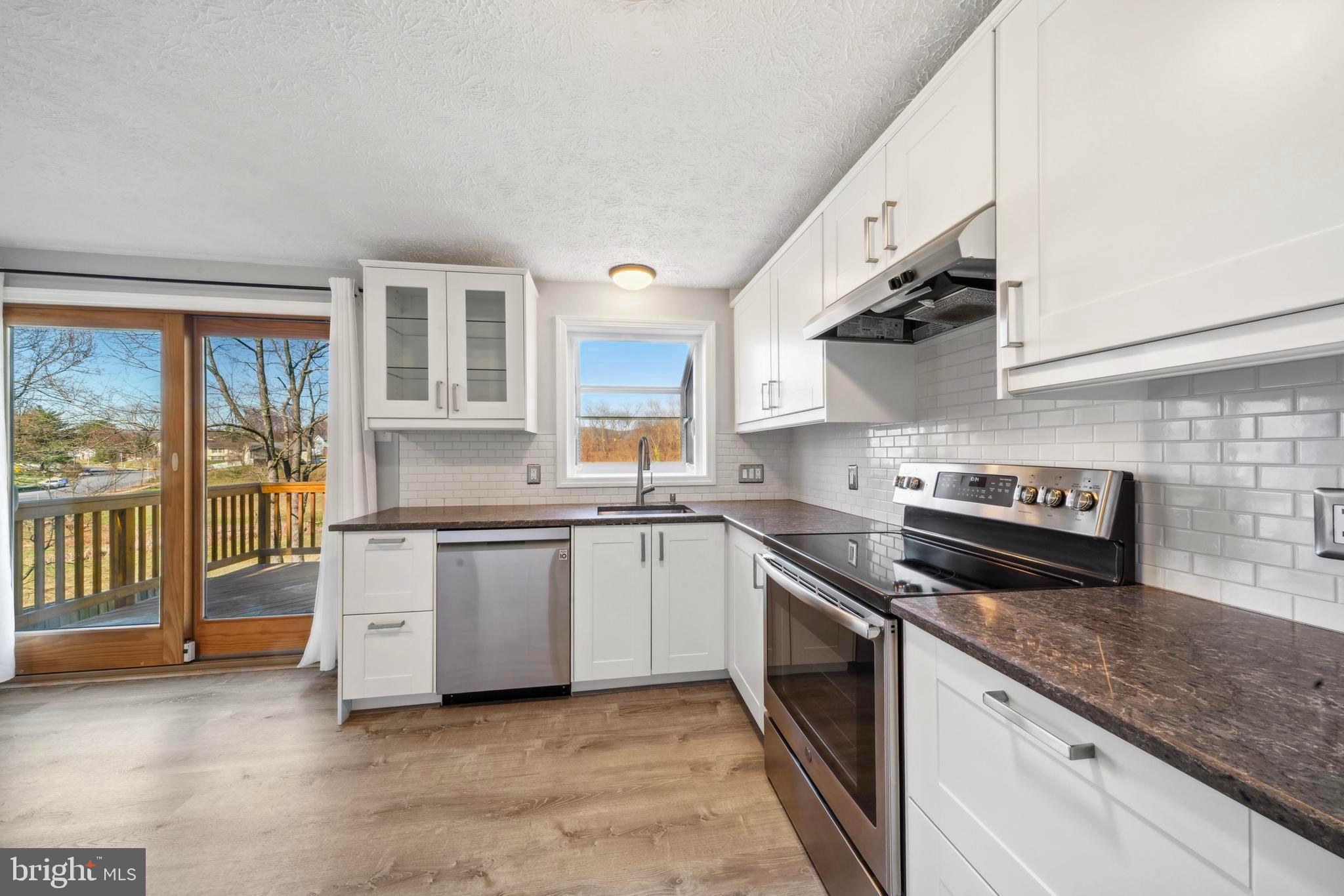 1335 Orchard Way Frederick, MD 21703 - Photo 12 of 42 a kitchen with stainless steel appliances granite countertop a stove and a sink