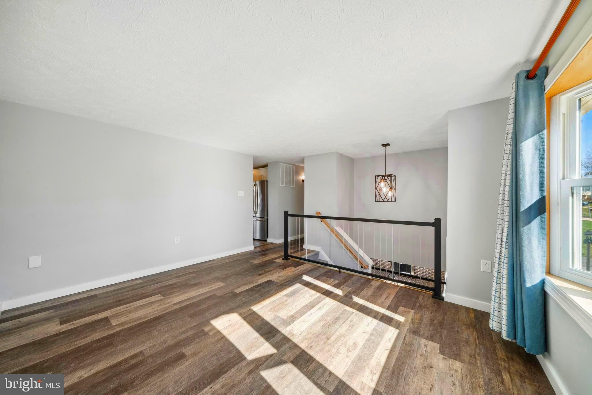 1335 Orchard Way Frederick, MD 21703 - Photo 17 of 42 a view of a room with wooden floor and windows
