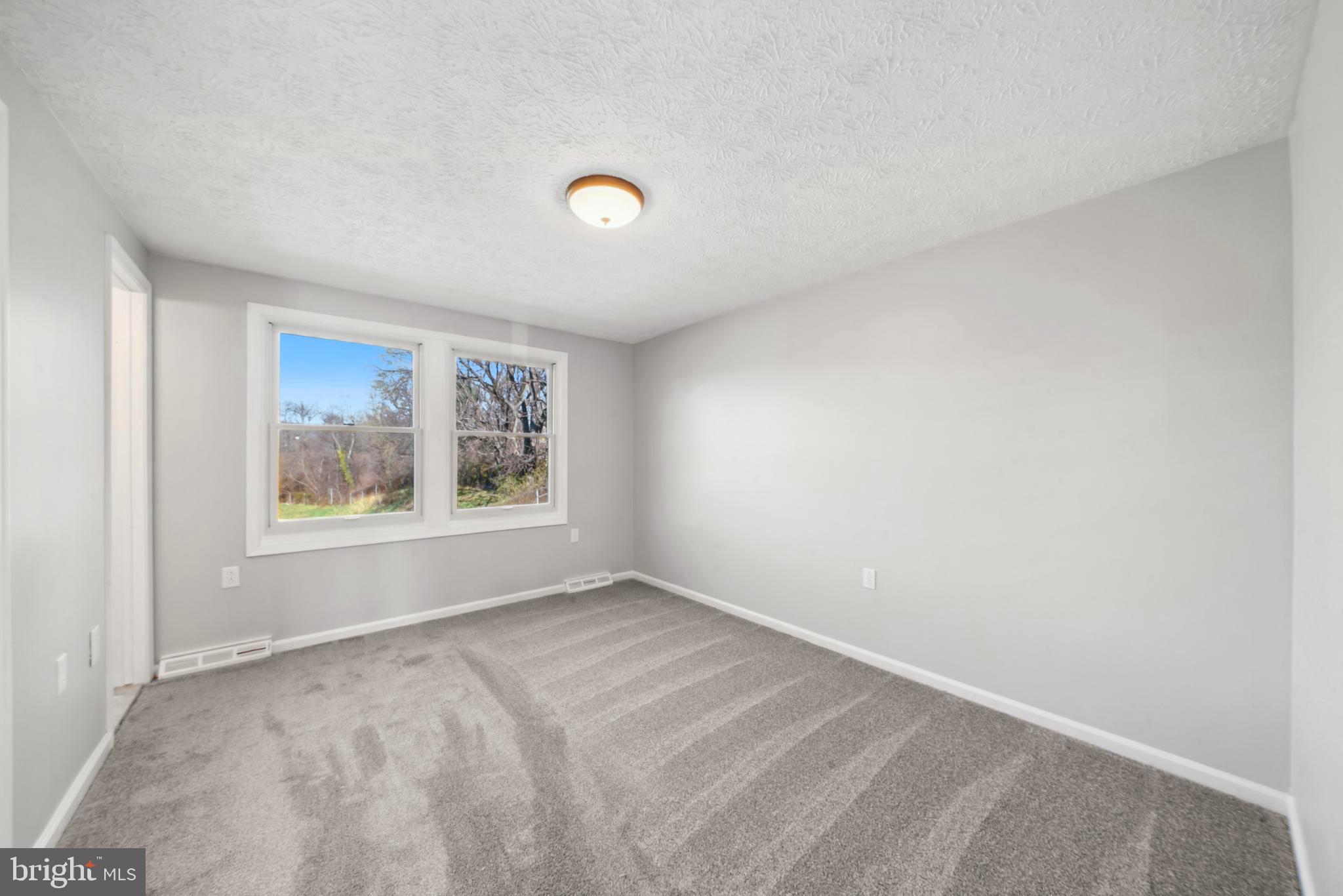 1335 Orchard Way Frederick, MD 21703 - Photo 22 of 42 a view of empty room with window