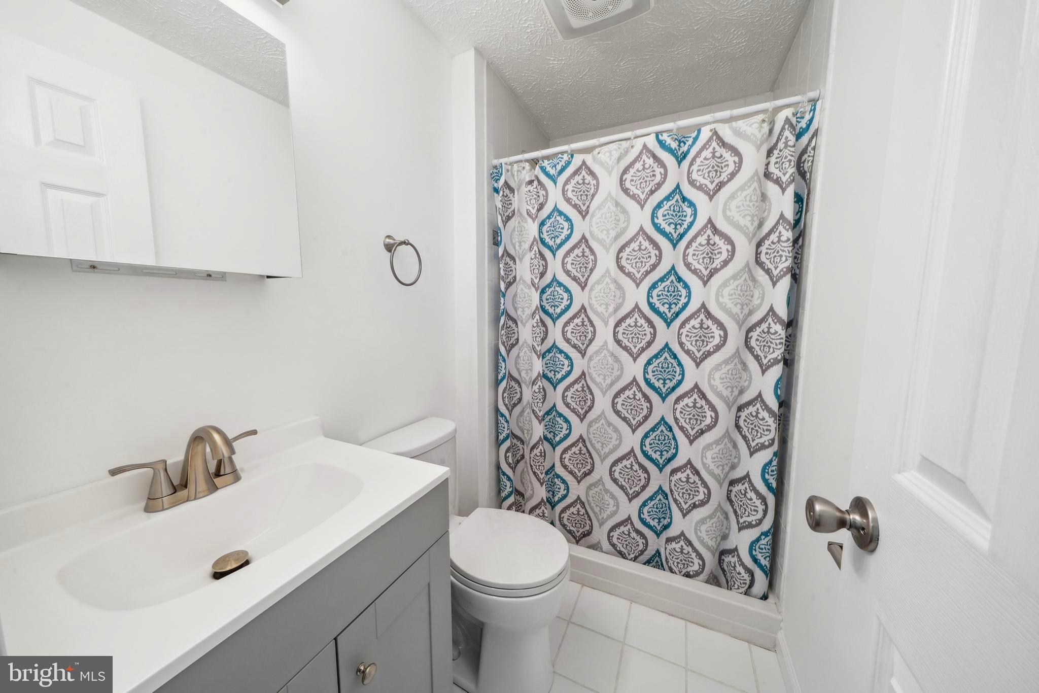1335 Orchard Way Frederick, MD 21703 - Photo 23 of 42 a bathroom with a sink and mirror with toilet