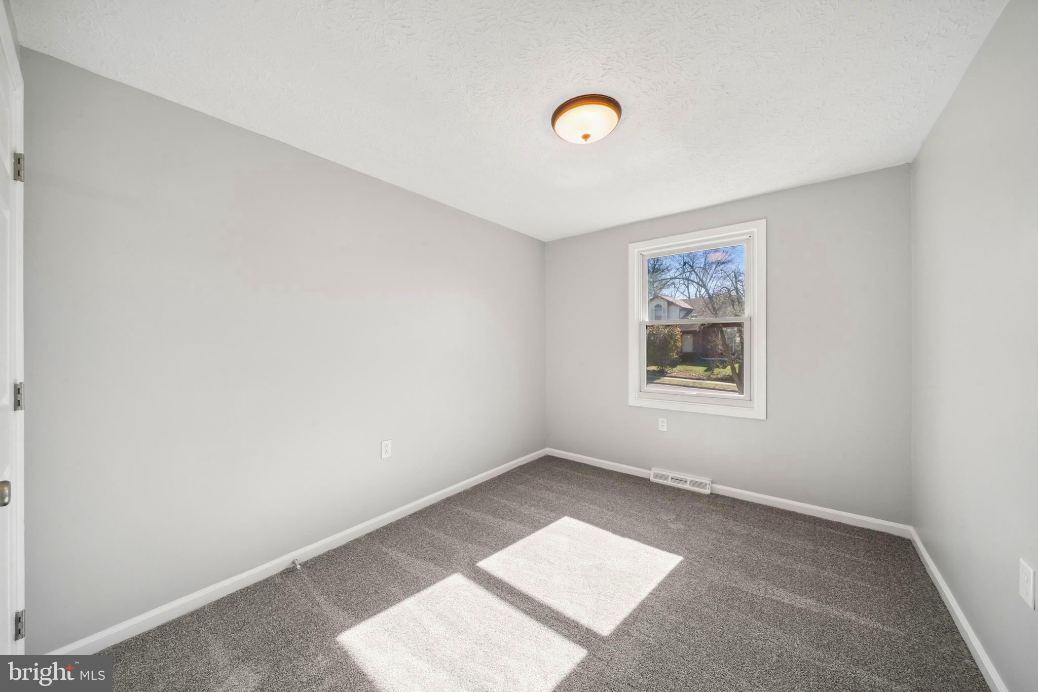 1335 Orchard Way Frederick, MD 21703 - Photo 24 of 42 an empty room with windows