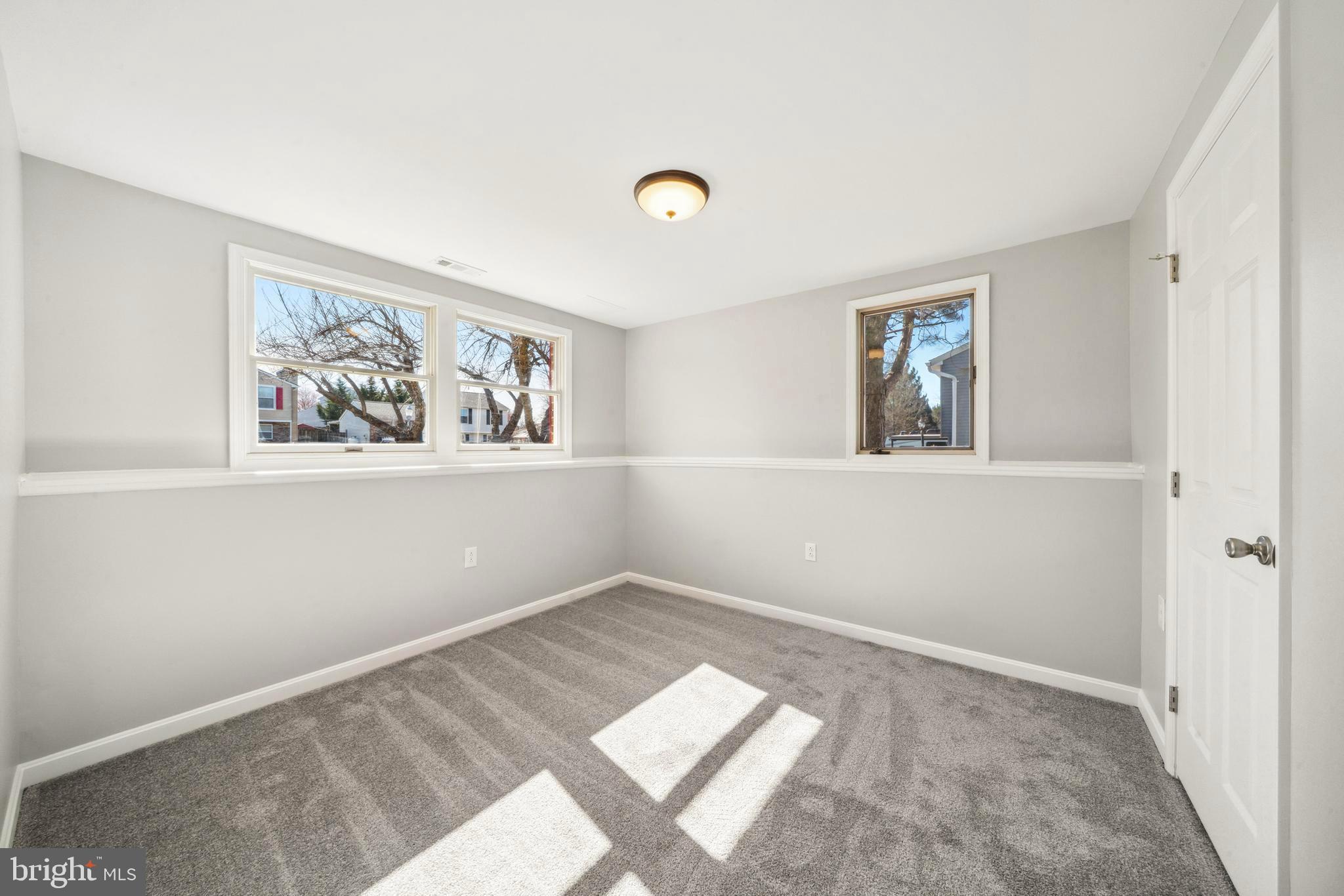 1335 Orchard Way Frederick, MD 21703 - Photo 26 of 42 a view of a big room with wooden floor and windows