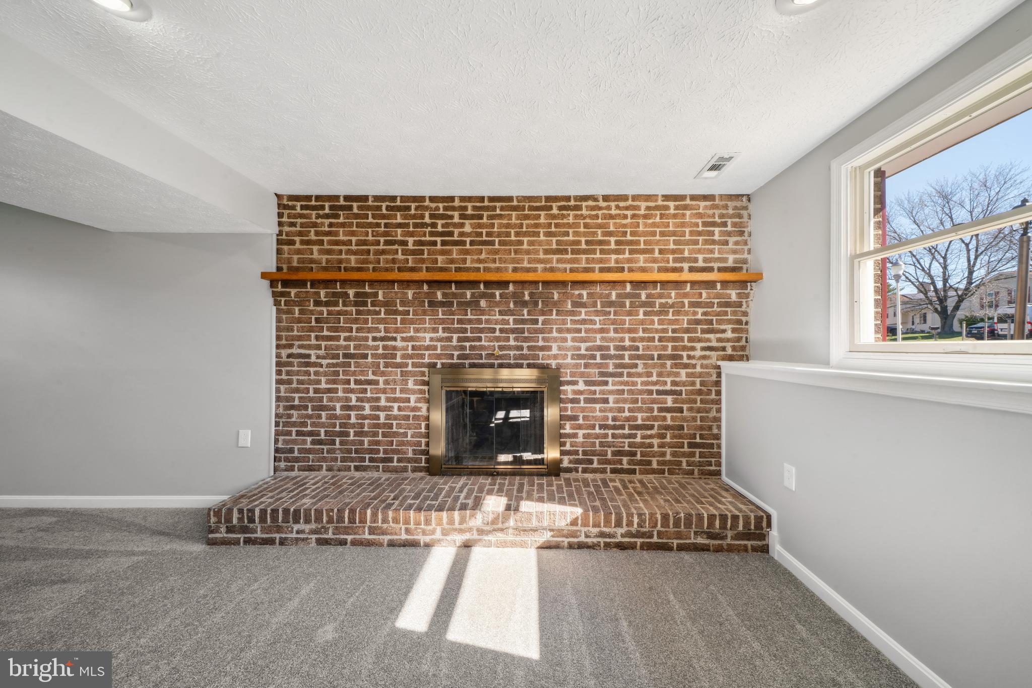 1335 Orchard Way Frederick, MD 21703 - Photo 29 of 42 a living room with a fireplace