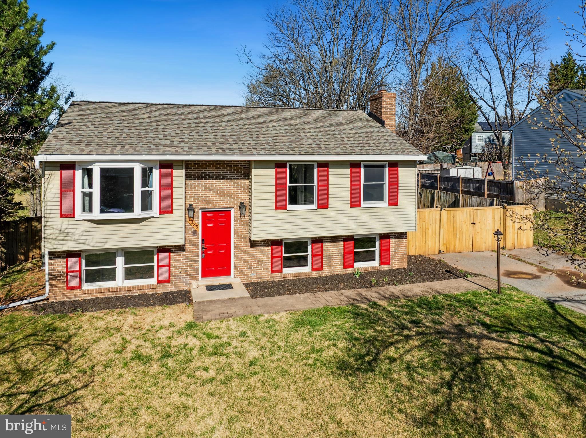 1335 Orchard Way Frederick, MD 21703 - Photo 3 of 42 a front view of a house with a big yard