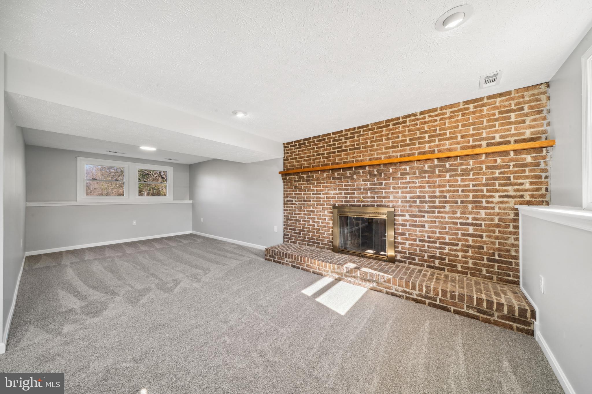 1335 Orchard Way Frederick, MD 21703 - Photo 31 of 42 a view of empty room with a fireplace