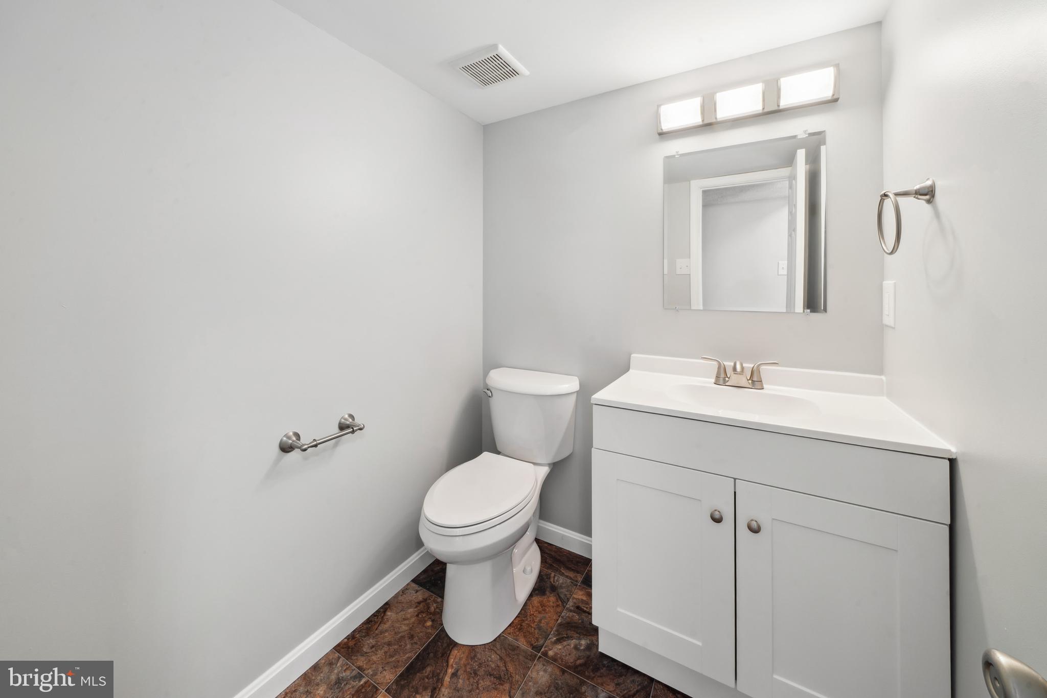 1335 Orchard Way Frederick, MD 21703 - Photo 33 of 42 a bathroom with a sink toilet and vanity