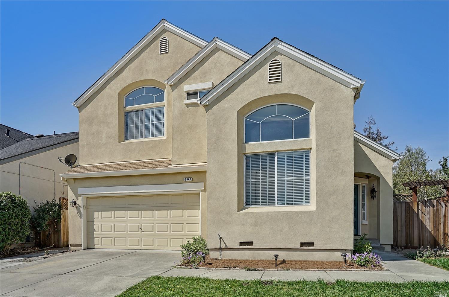 2349 Wicket Avenue Santa Rosa, CA 95403 - Photo 1 of 1 a front view of a house with a yard and garage