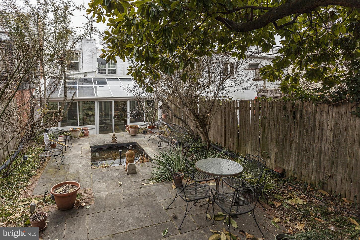 2523 P Street Northwest Washington, DC 20007 - Photo 13 of 14 a view of a table and chairs in backyard