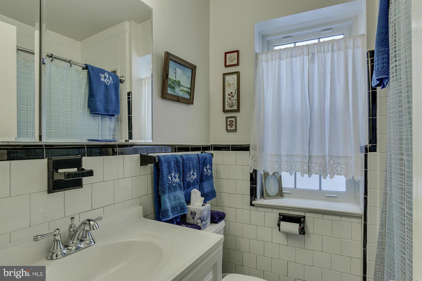 2523 P Street Northwest Washington, DC 20007 - Photo 10 of 14 a bathroom with a sink and a mirror