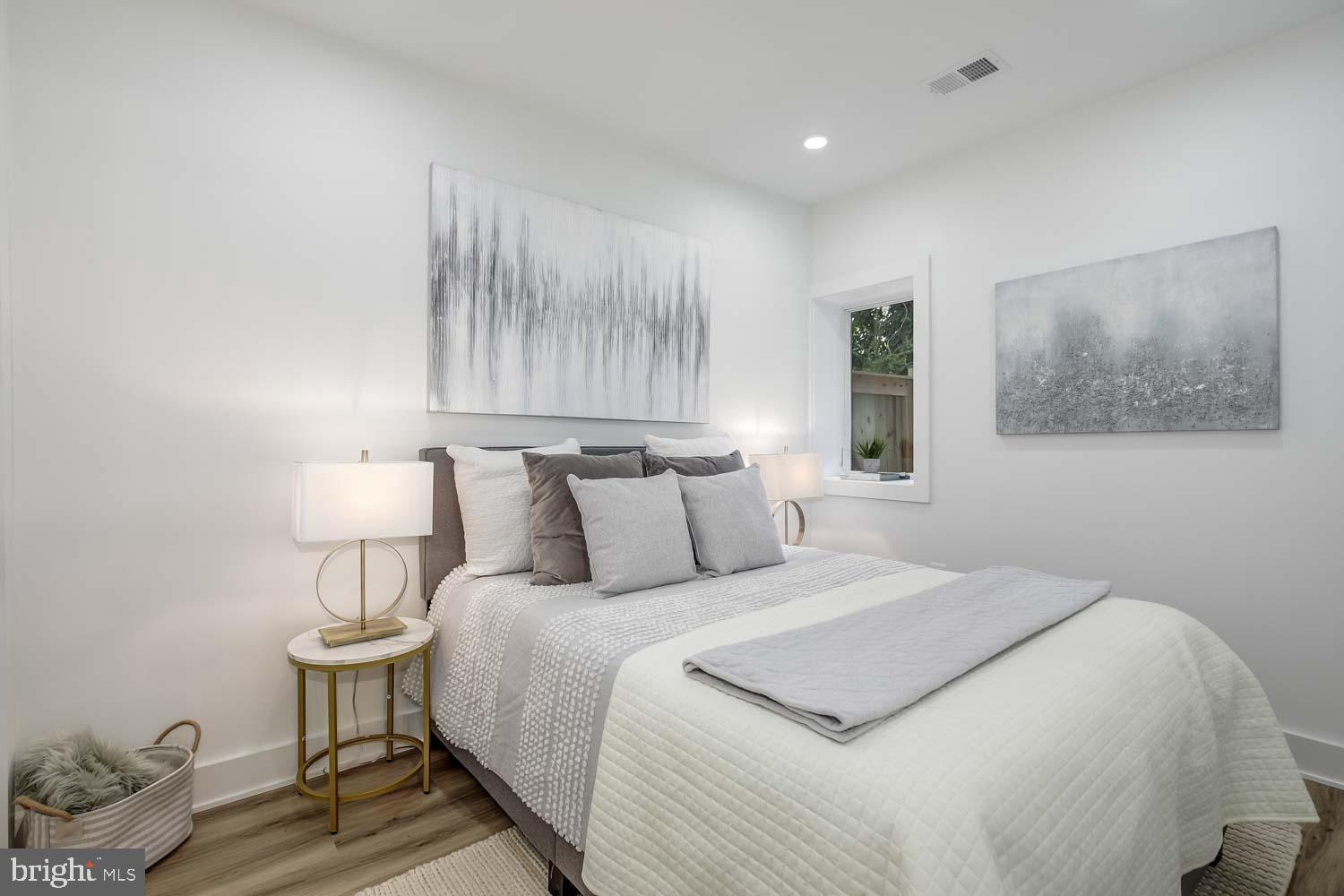 428 Manor Place Northwest, Unit A Washington, DC 20010 - Photo 8 of 21 a bedroom with bed and a night stand