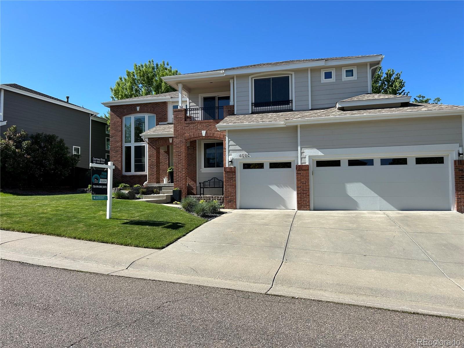 6596 Millstone Street Highlands Ranch, CO 80130 - Photo 2 of 33 front view of house with a yard