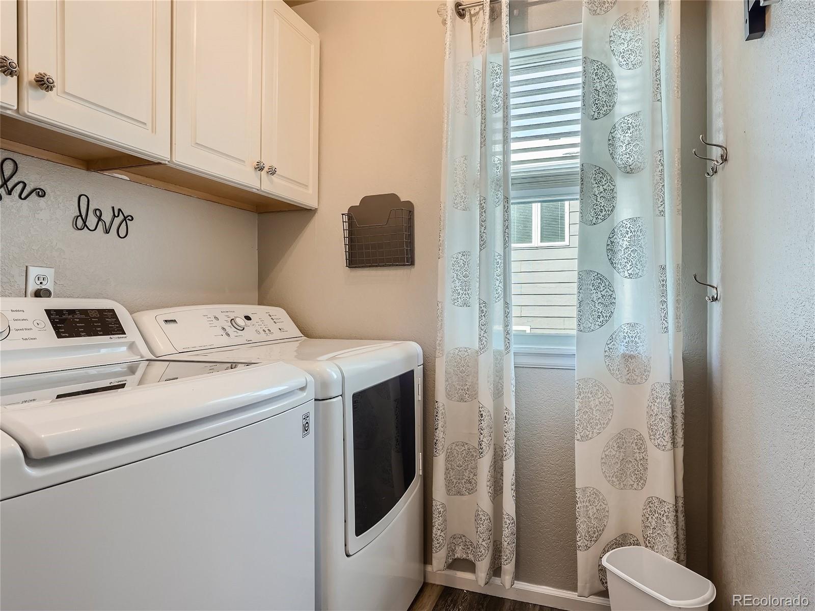 6596 Millstone Street Highlands Ranch, CO 80130 - Photo 26 of 33 a utility room with dryer and washer