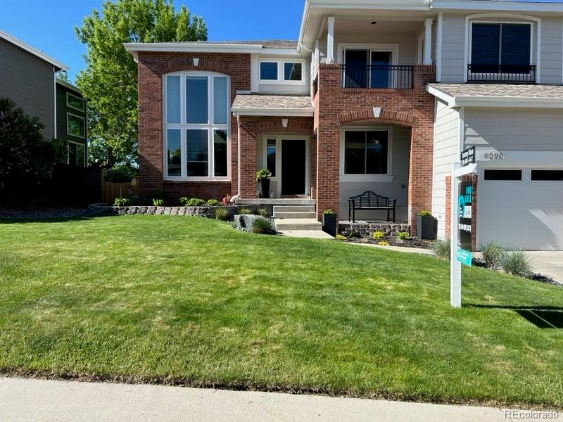 6596 Millstone Street Highlands Ranch, CO 80130 - Photo 4 of 33 a house view with a garden space