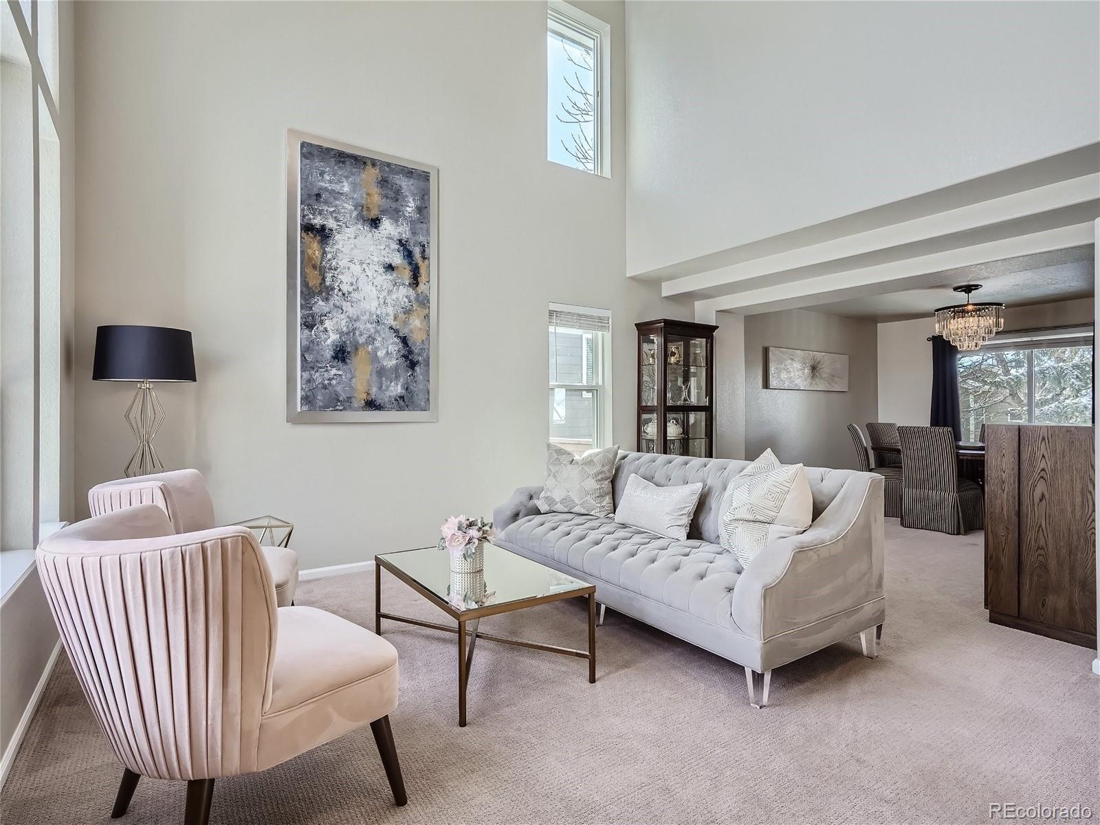 6596 Millstone Street Highlands Ranch, CO 80130 - Photo 6 of 33 a living room with furniture and a potted plant
