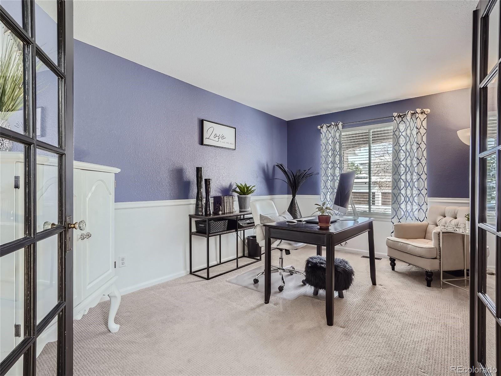 6596 Millstone Street Highlands Ranch, CO 80130 - Photo 8 of 33 a living room with furniture a rug and a window