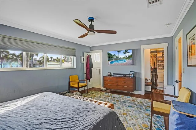 a bedroom with a bed and window