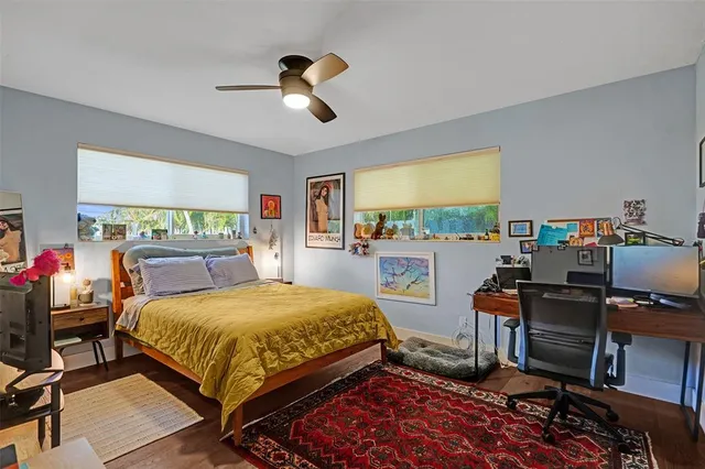 a bedroom with a bed and a desk