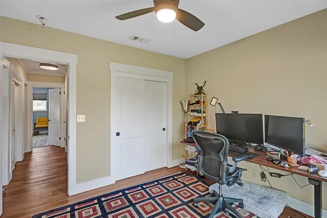a view of a workspace with furniture and gym equipment