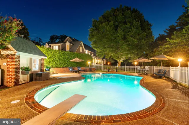 a view of a swimming pool with a patio