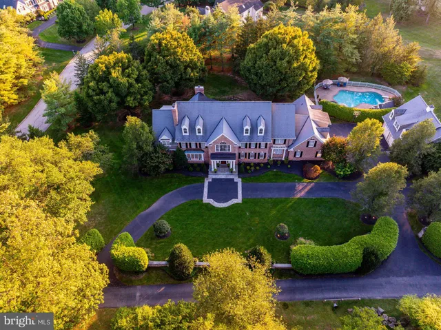 a view of a brick building next to a yard