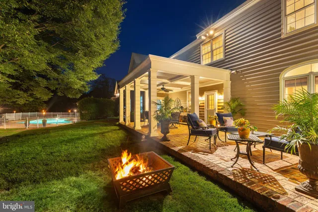 a outdoor living space with furniture and a fireplace